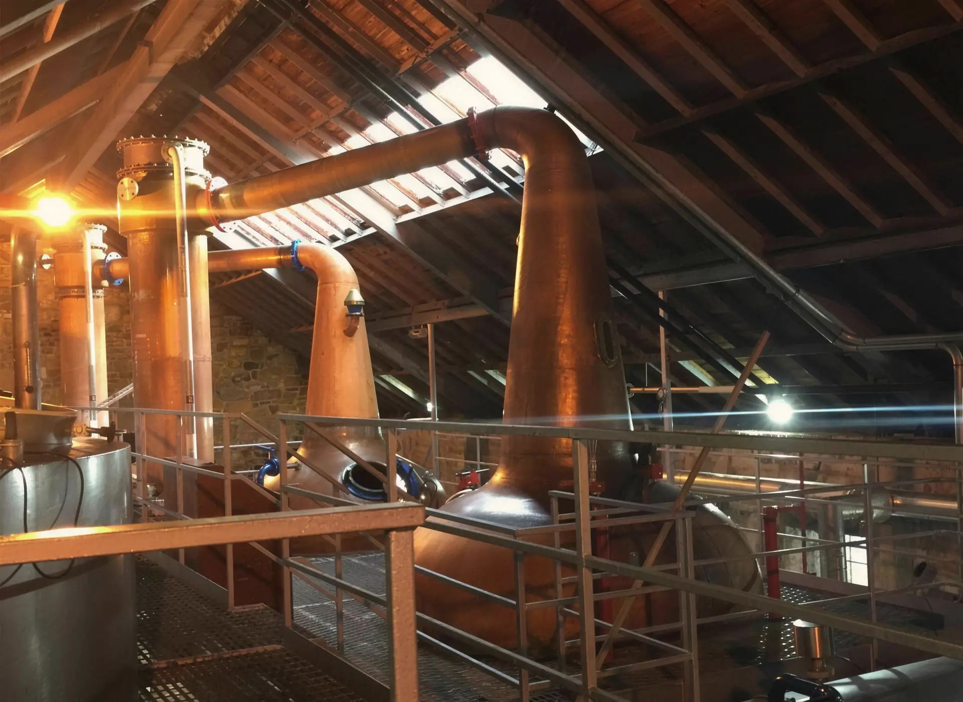 Copper pot stills inside a Speyside stillhouse